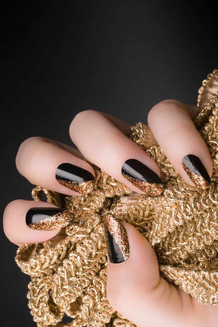 Glossy Black Nails with Gold Glitter