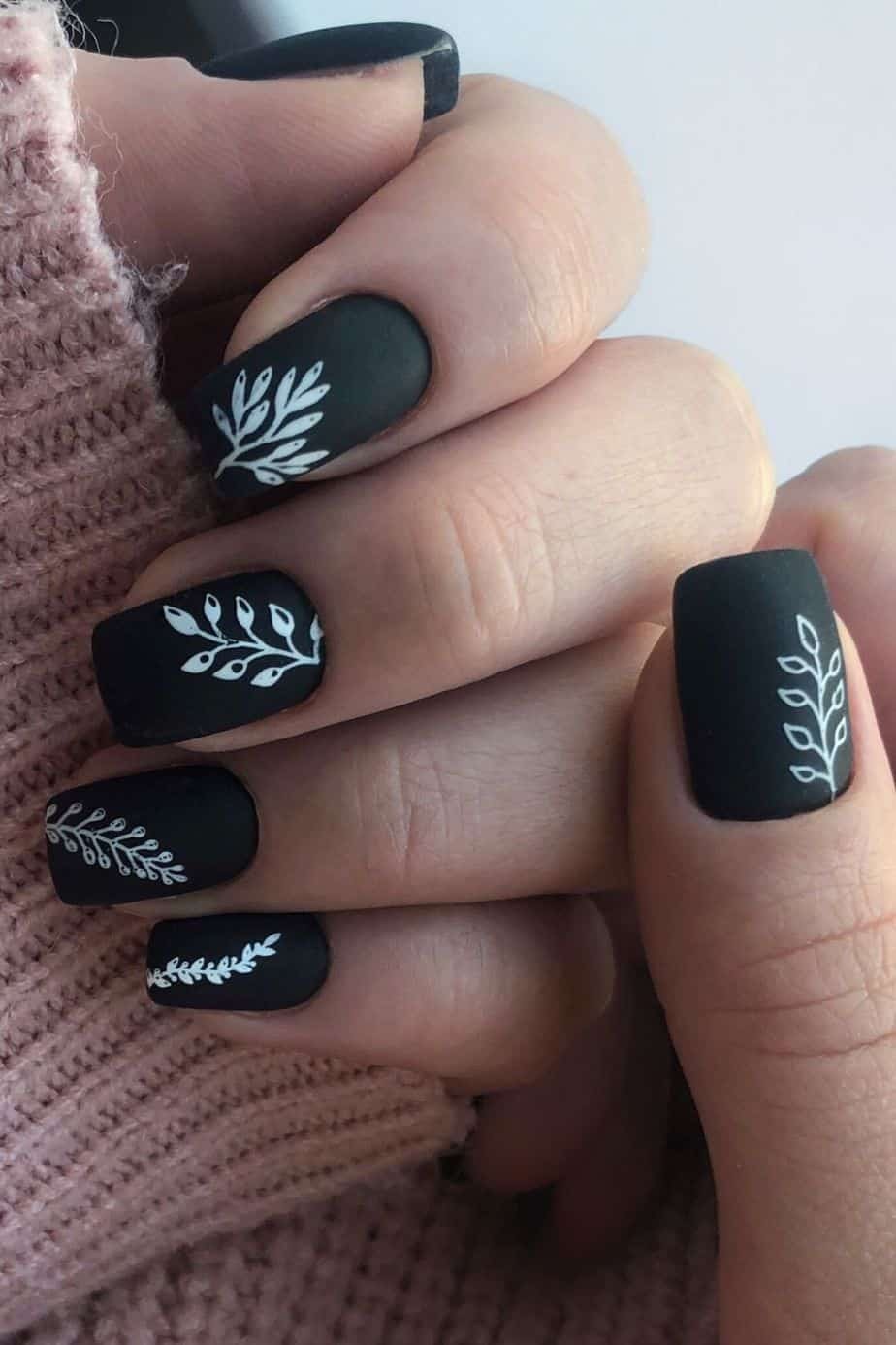 Black Nail Design with White Leaves